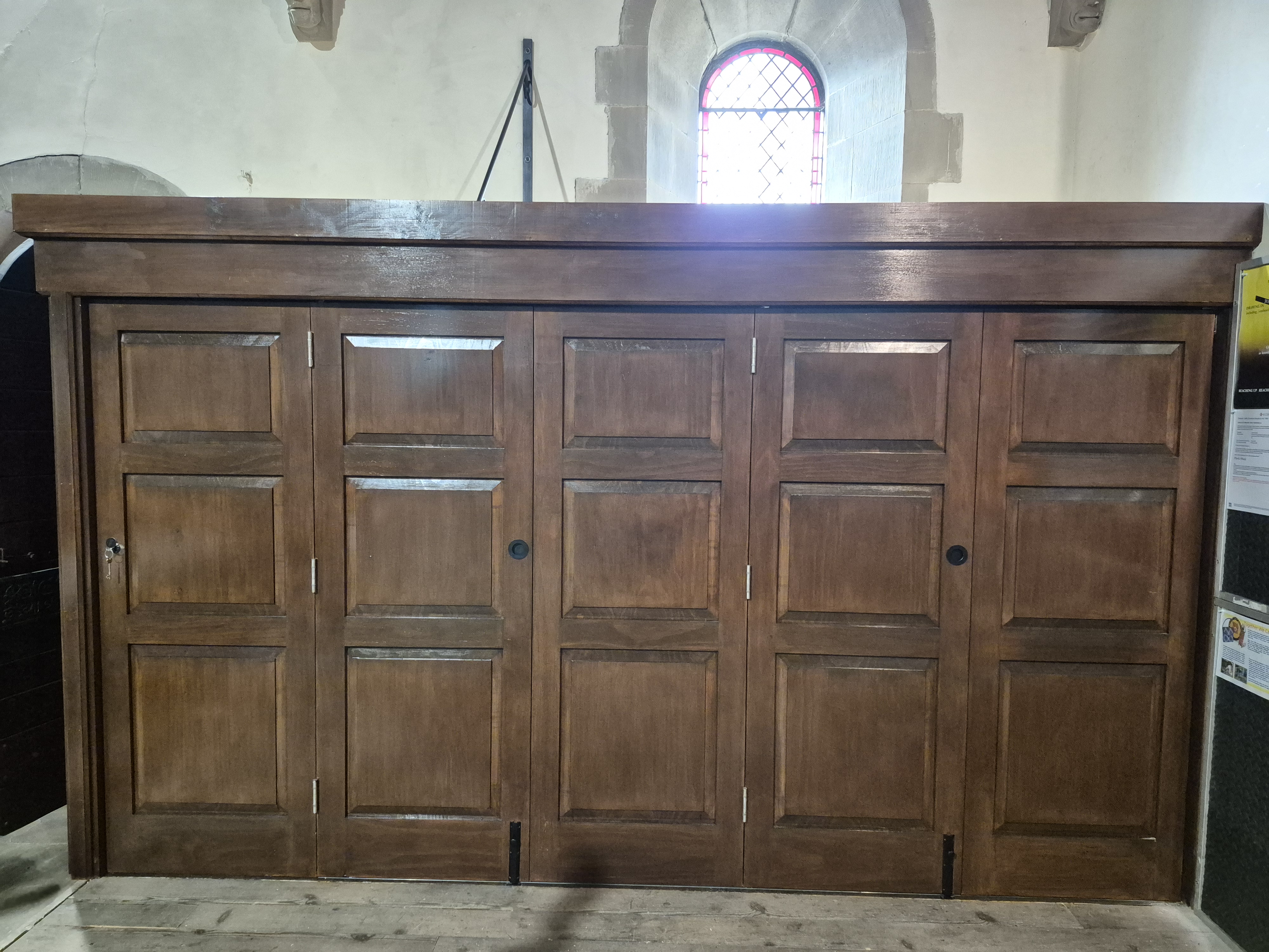 Dark timber cabinetry in a church interior