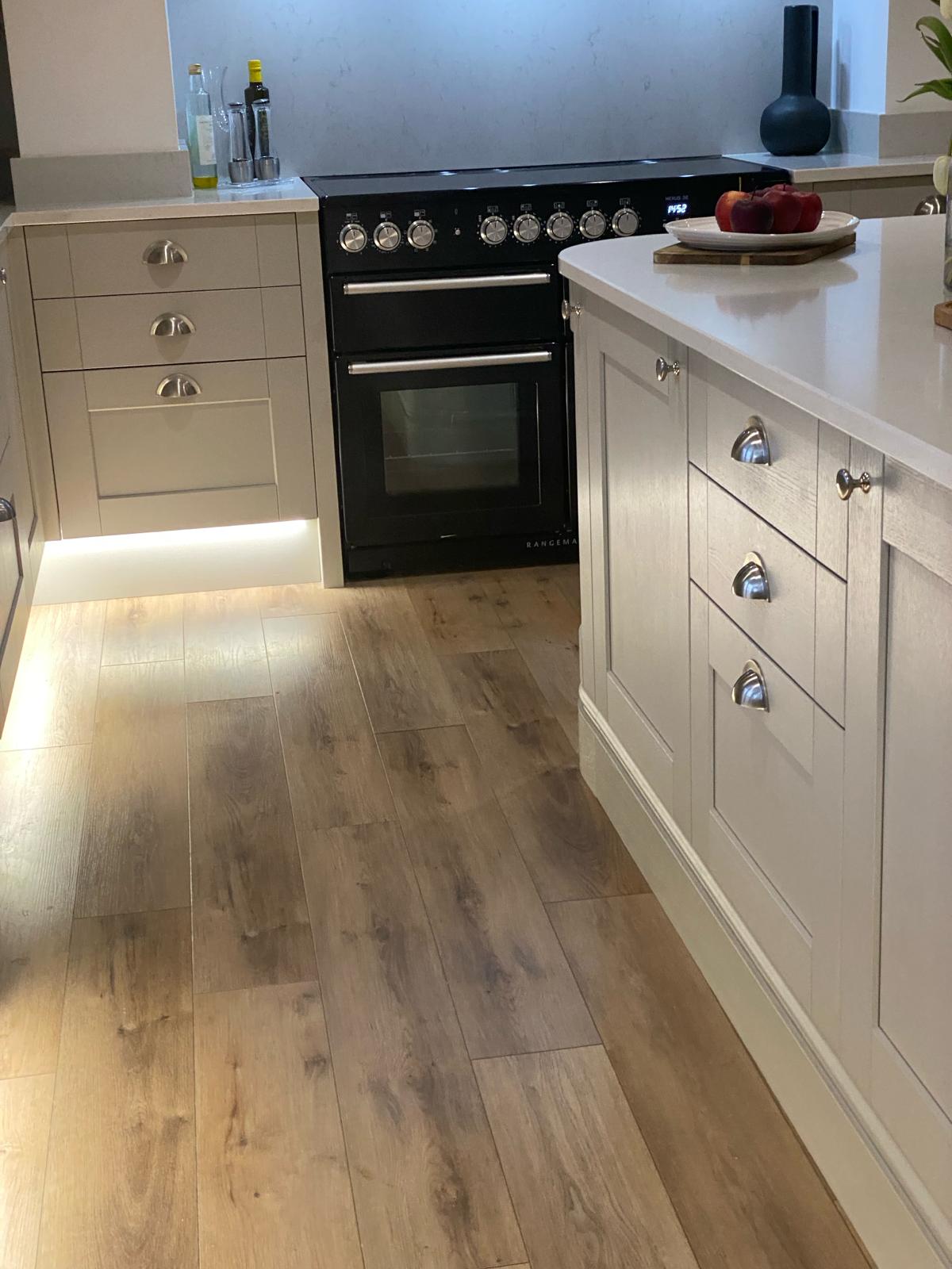 Neutral handmade kitchen cabinetry with range cooker