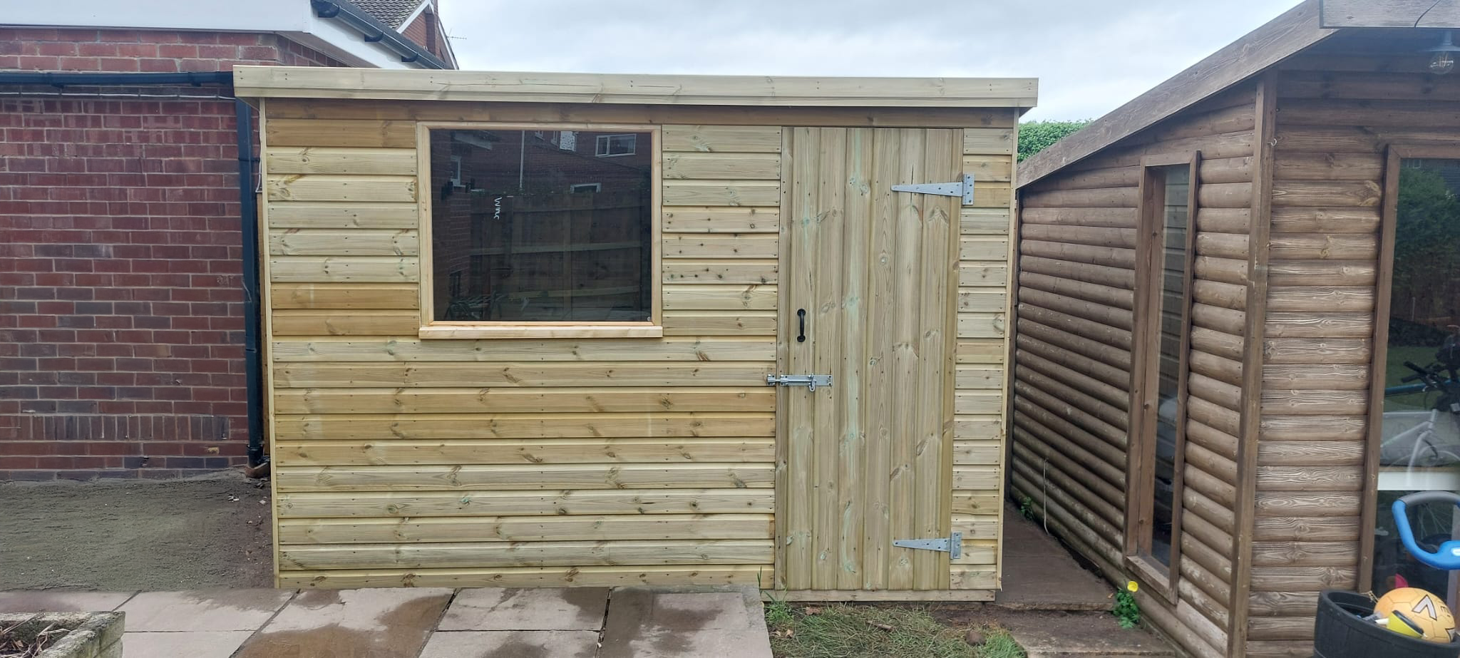Timber shed with window and single door