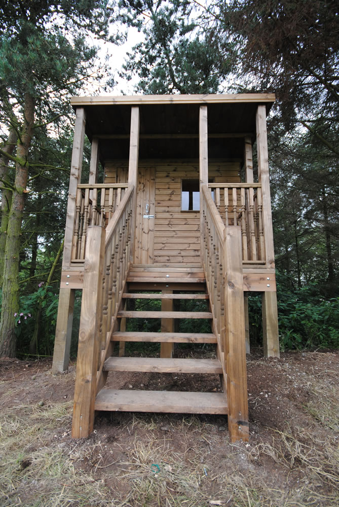 Raised timber treehouse with stairs